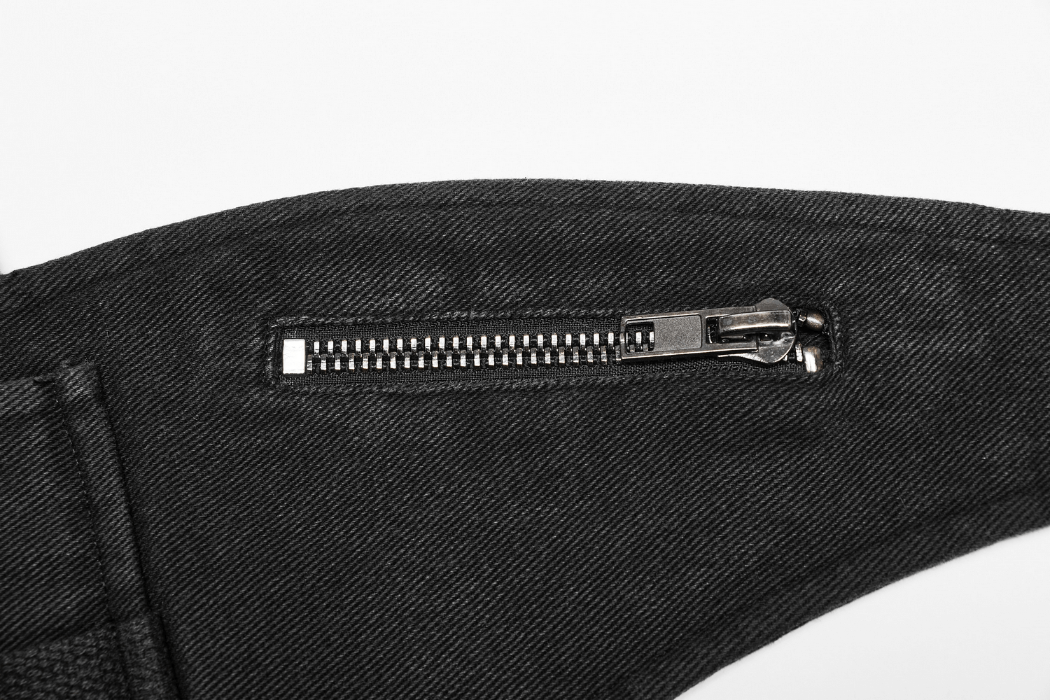 Close-up of a zipper detail on the Tactical Punk Detachable Bag showcasing its edgy design and craftsmanship.