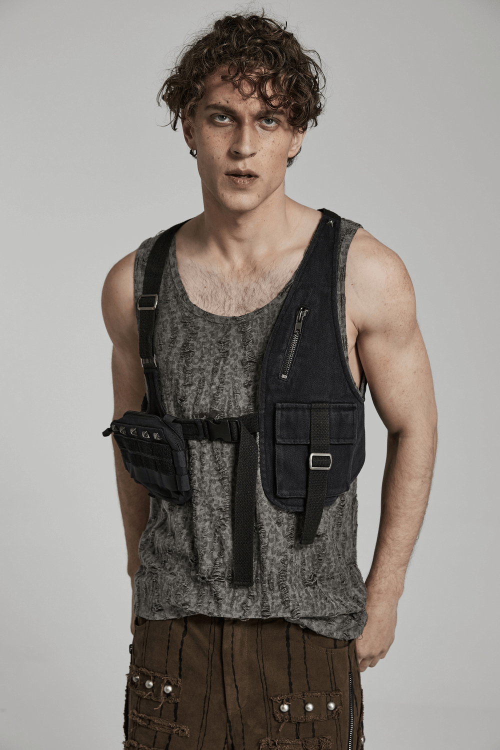 Model showcasing a Tactical Punk Detachable Bag with Belt, highlighting avant-garde design and practicality.