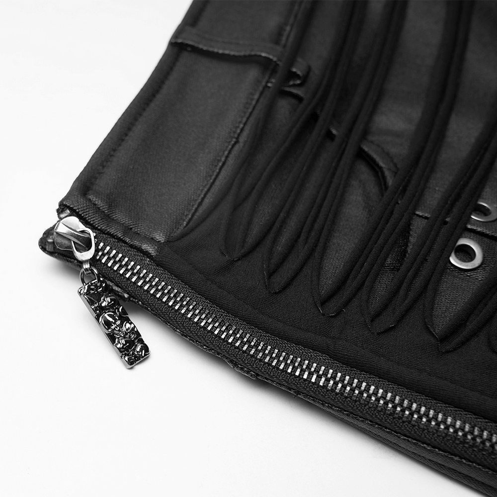 Close-up of black PU leather skirt showcasing tassel detail and metal eyelets with stylish zipper.