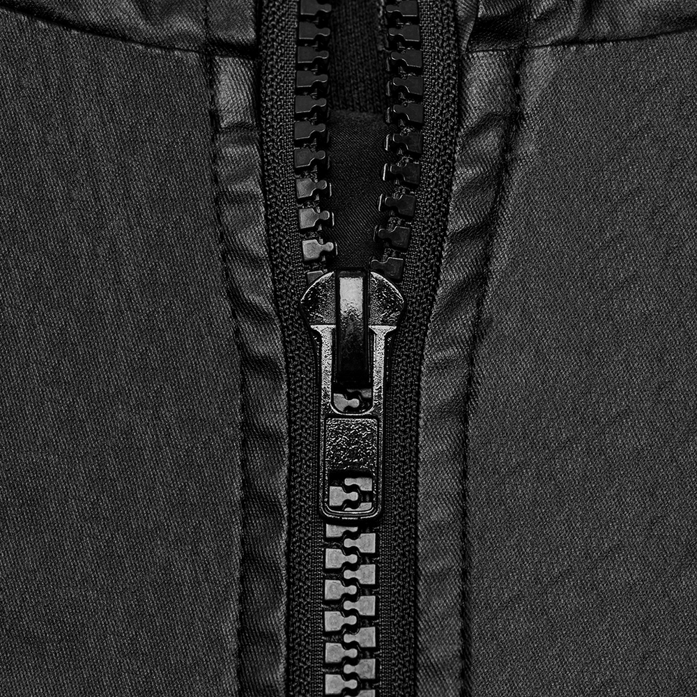 Close-up of a sleek black zipper on a sleeveless hoodie, showcasing stylish techwear design and premium details.
