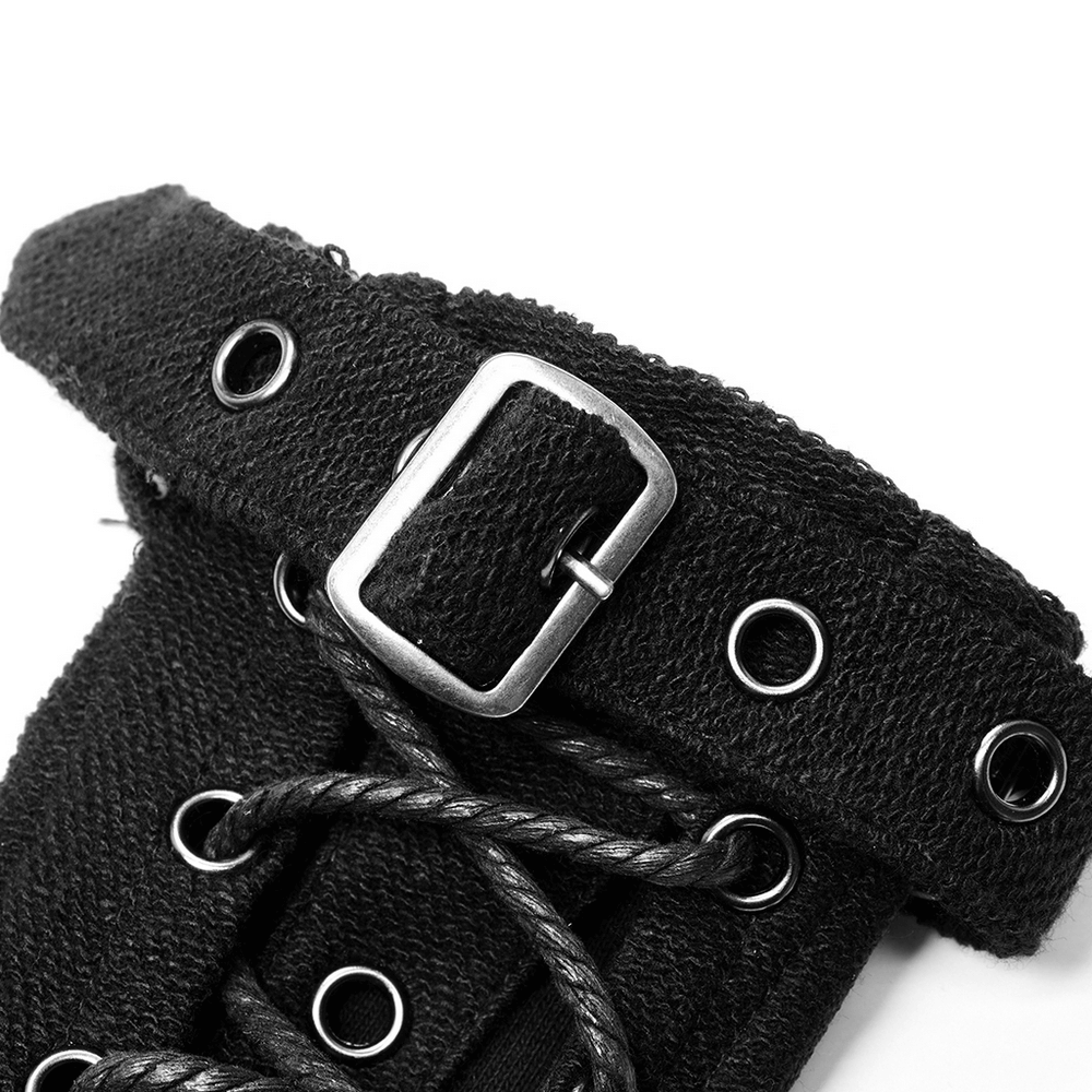 Close-up of textured punk glove featuring adjustable buckle and eyelet details for a stylish look.