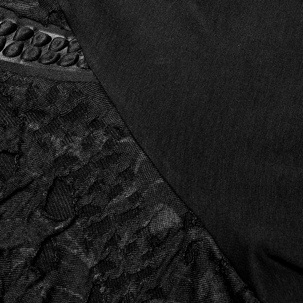 Close-up of textured webbed gothic knit fabric, showcasing intricate patterns in black for a stylish goth look.