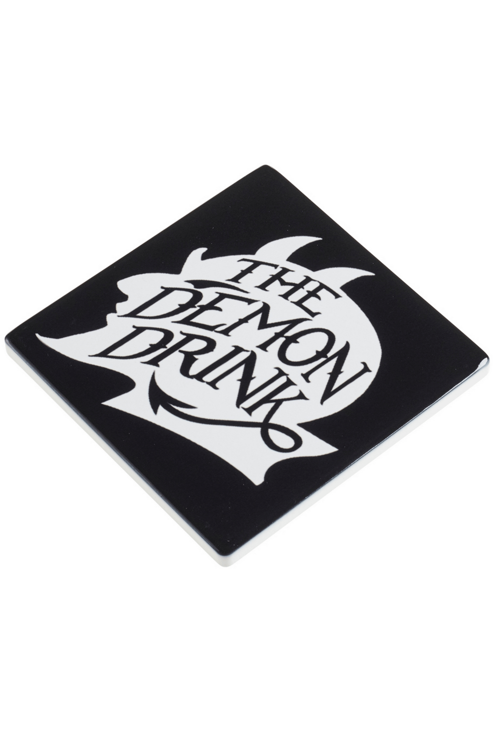 Ceramic coaster 'The Demon Drink' featuring a devilish skull design for gothic home decor.