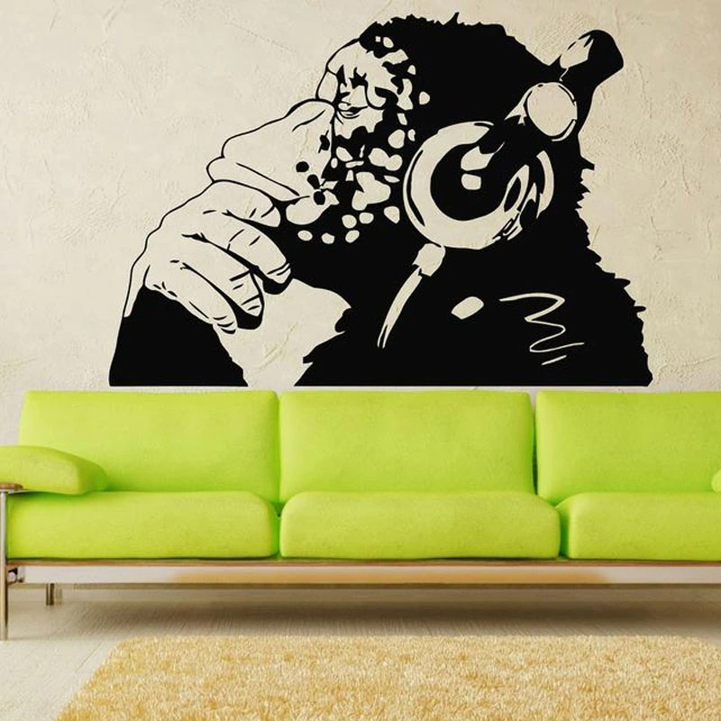 Thinking monkey wall sticker in black vinyl, modern art for living room decor, featuring headphones and playful design.
