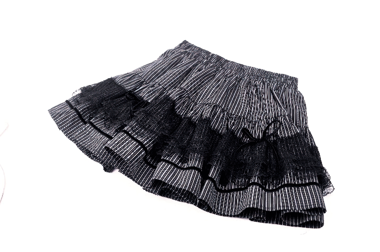 Tiered stripe skirt with lace details and ruffles, perfect for adding flair to any outfit.