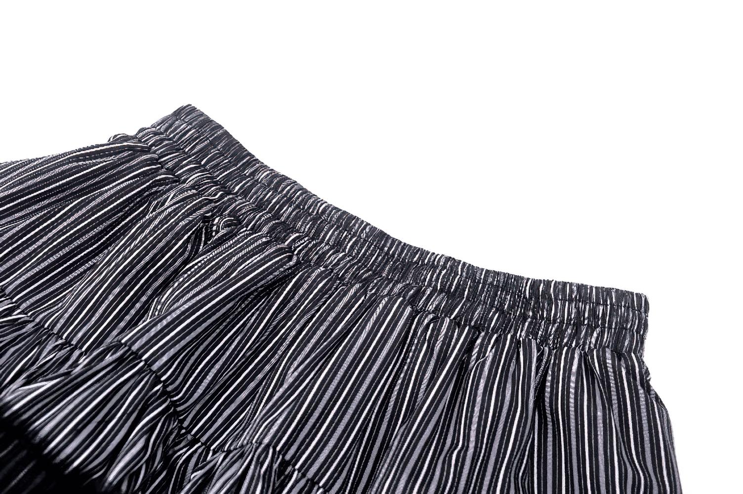 Close-up of the waistband of a tiered striped skirt showcasing elegant ruffles and fine stripes.