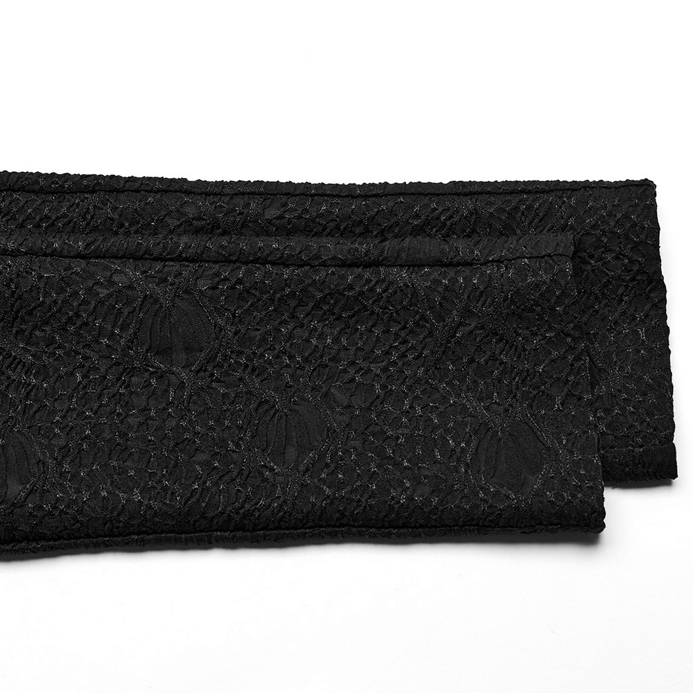 Black lace fabric showcasing gothic textured pattern, perfect for edgy legging designs.