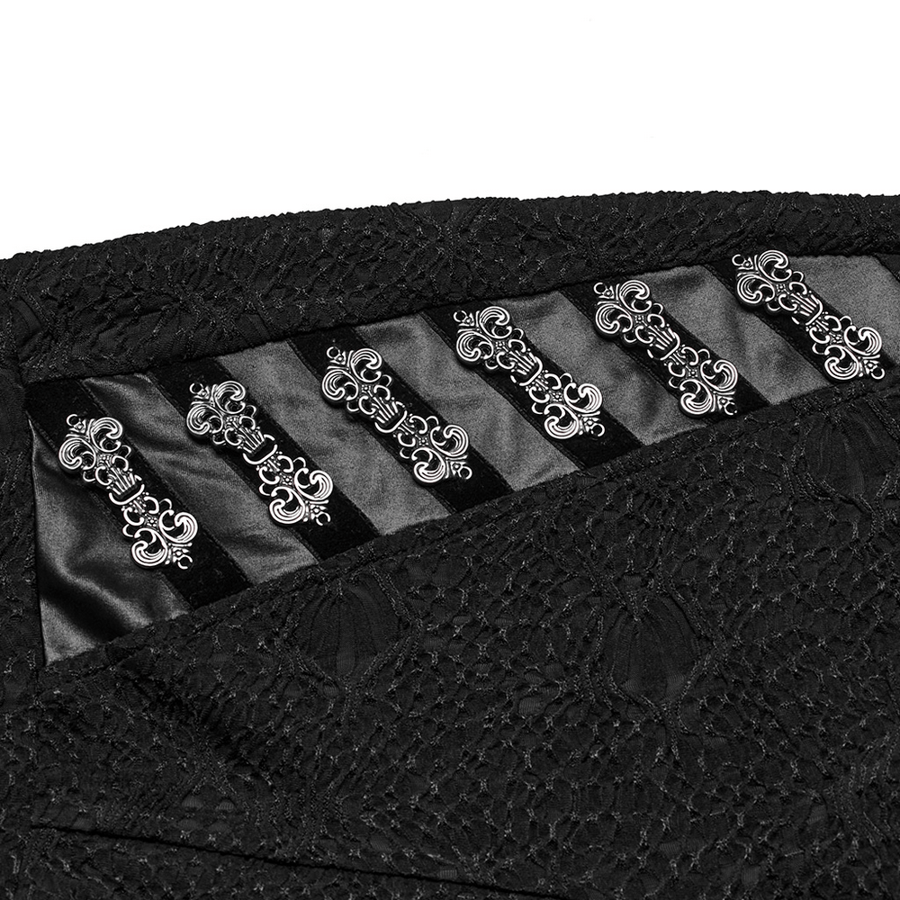 Close-up of Gothic black lace leggings featuring intricate engraved buckles for edgy style.