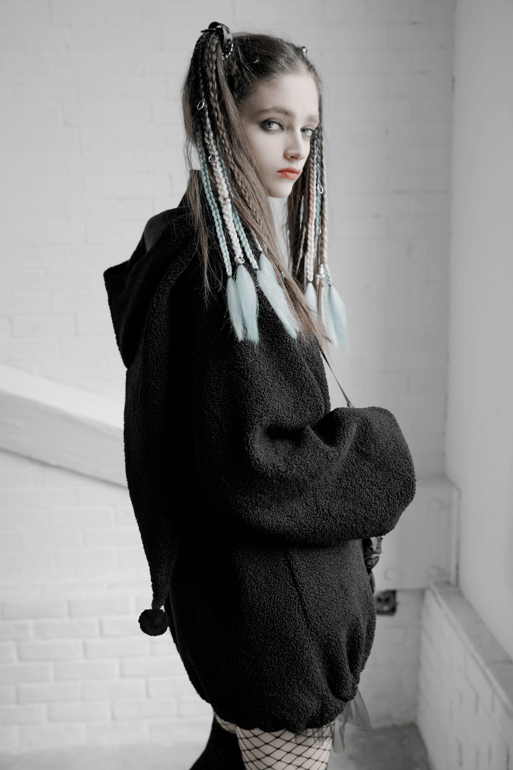 Trendy black hooded plush jacket with playful clown hat design and cute accessories, perfect for fall fashion.