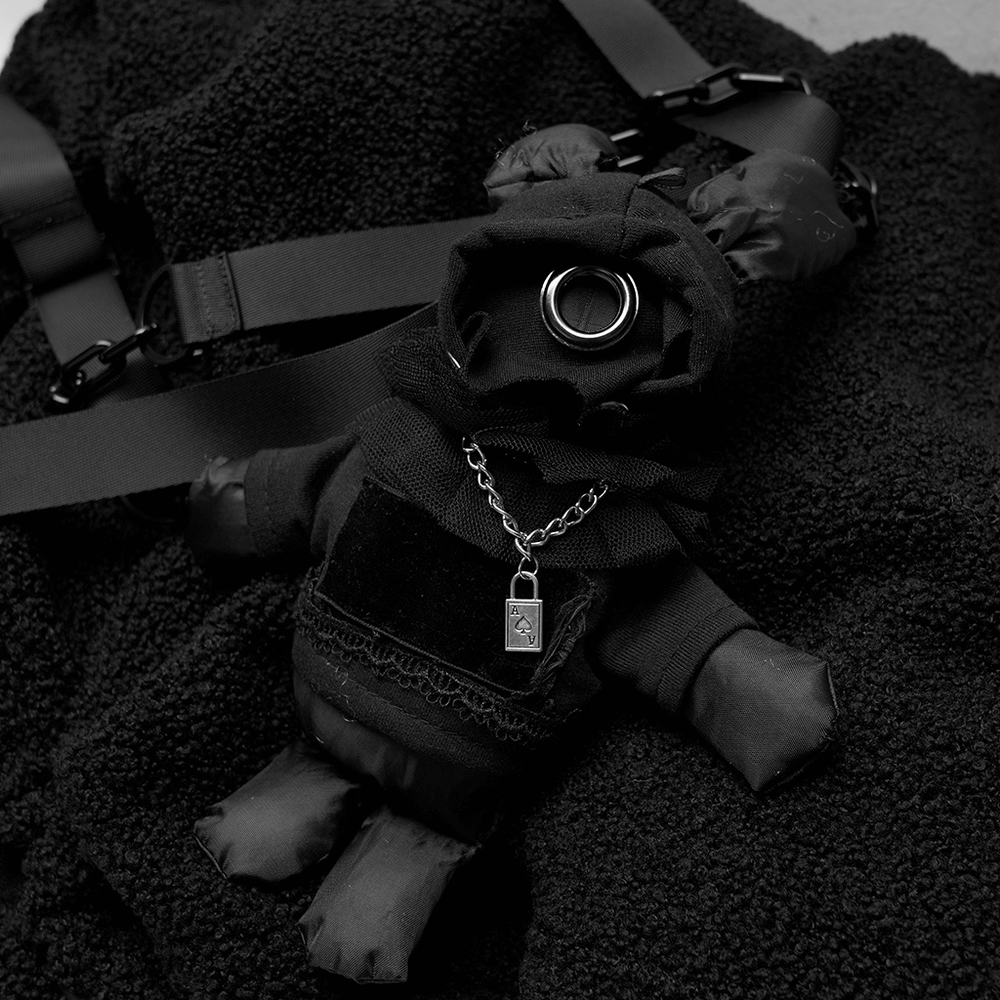 Edgy black rabbit plush doll with hoodie and chain accessory, resting on soft fabric background.