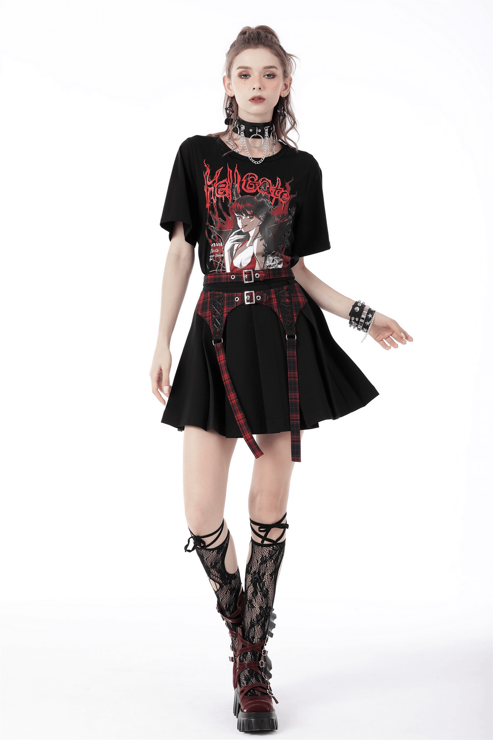 Trendy model wearing plaid and black mini skirt with buckles, edgy t-shirt, and stylish accessories, perfect for any occasion.