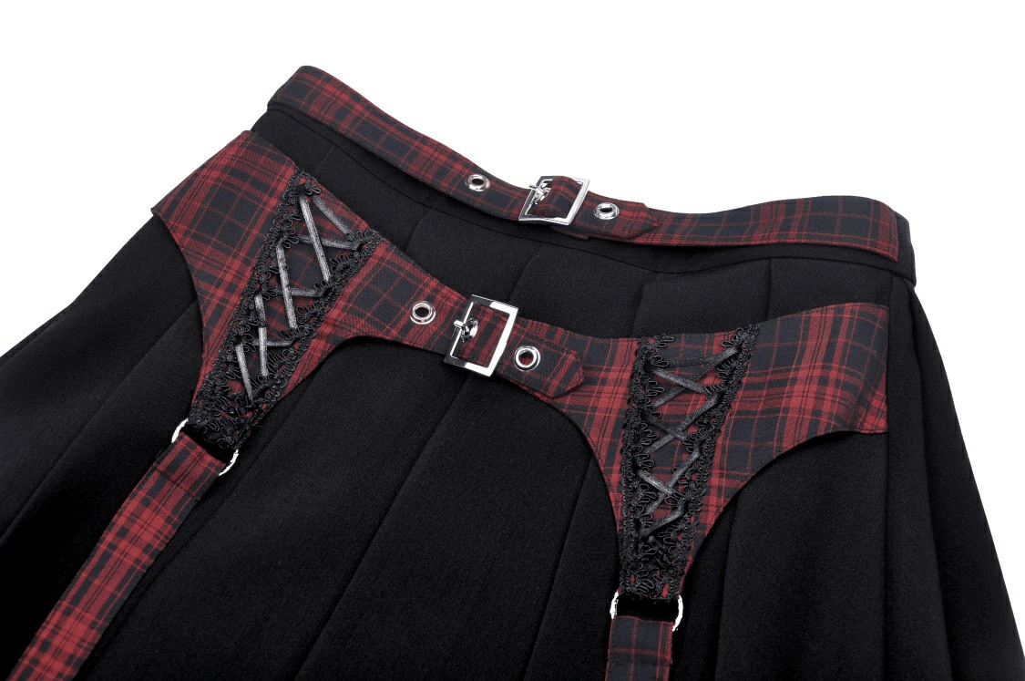 Trendy plaid and black mini skirt featuring stylish buckles and elegant pleats, perfect for any fashion-forward wardrobe.