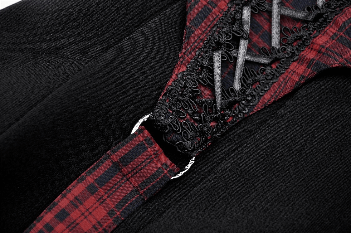 Close-up of trendy plaid and black mini skirt detailing with buckles and lace accents for stylish outfits.