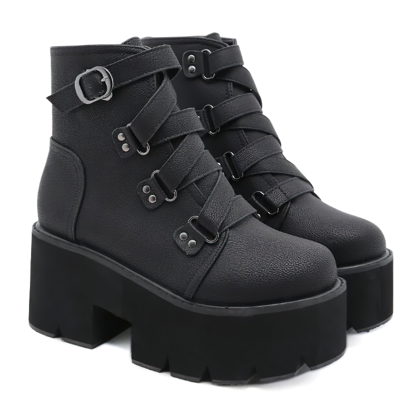 Trendy black leather ankle boots with buckle straps and chunky platform for casual style.
