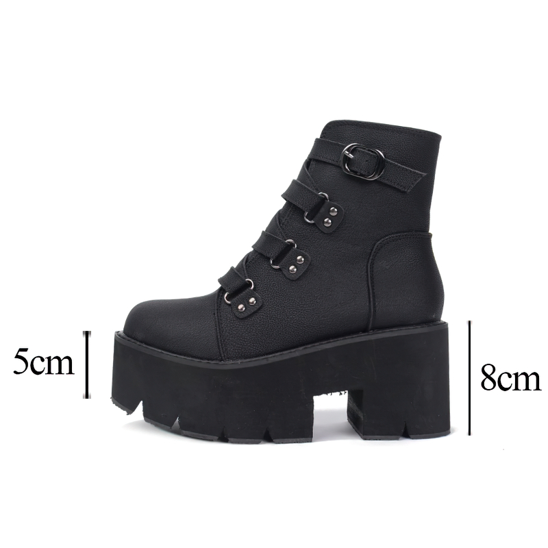 Trendy women's black leather ankle boots on platform with decorative buckle and straps, ideal for casual outfits.