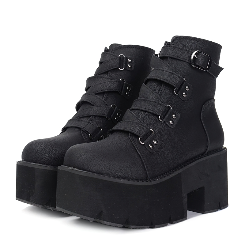 Trendy women's black leather ankle boots with a platform and buckle for stylish casual outfits.