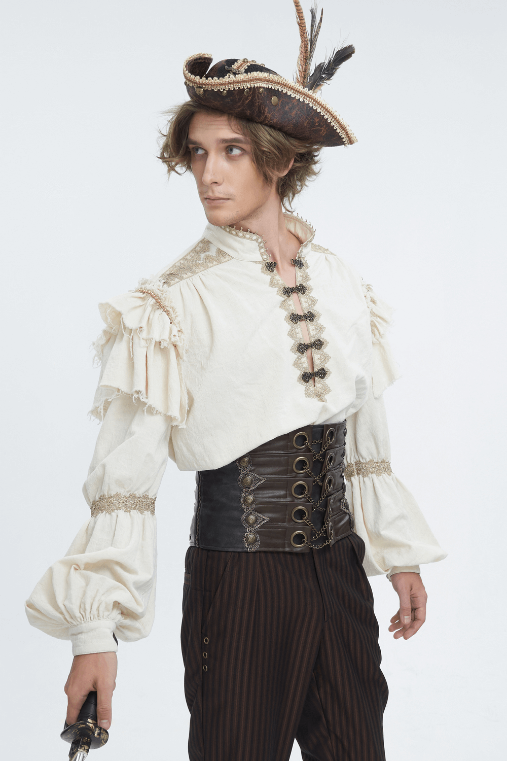 Stylish male model wearing a pirate tricorn hat with feather, ruffled shirt, and leather waistcoat.