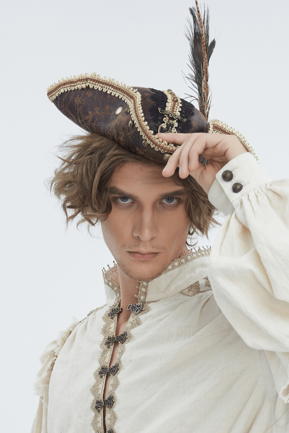 Model wearing an elegant pirate tricorn hat with gold trim and feather, styled for historical reenactment.