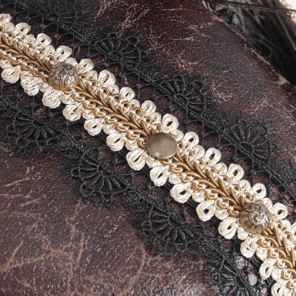 Close-up of gold trim and decorative emblem on a pirate tricorn hat, showcasing intricate detailing and elegant design.