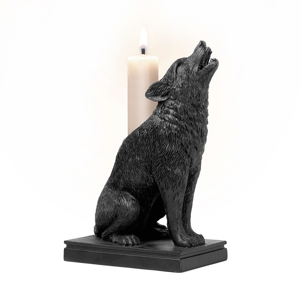 Black resin wolf howling candle holder with a white candle, perfect for gothic home decor.