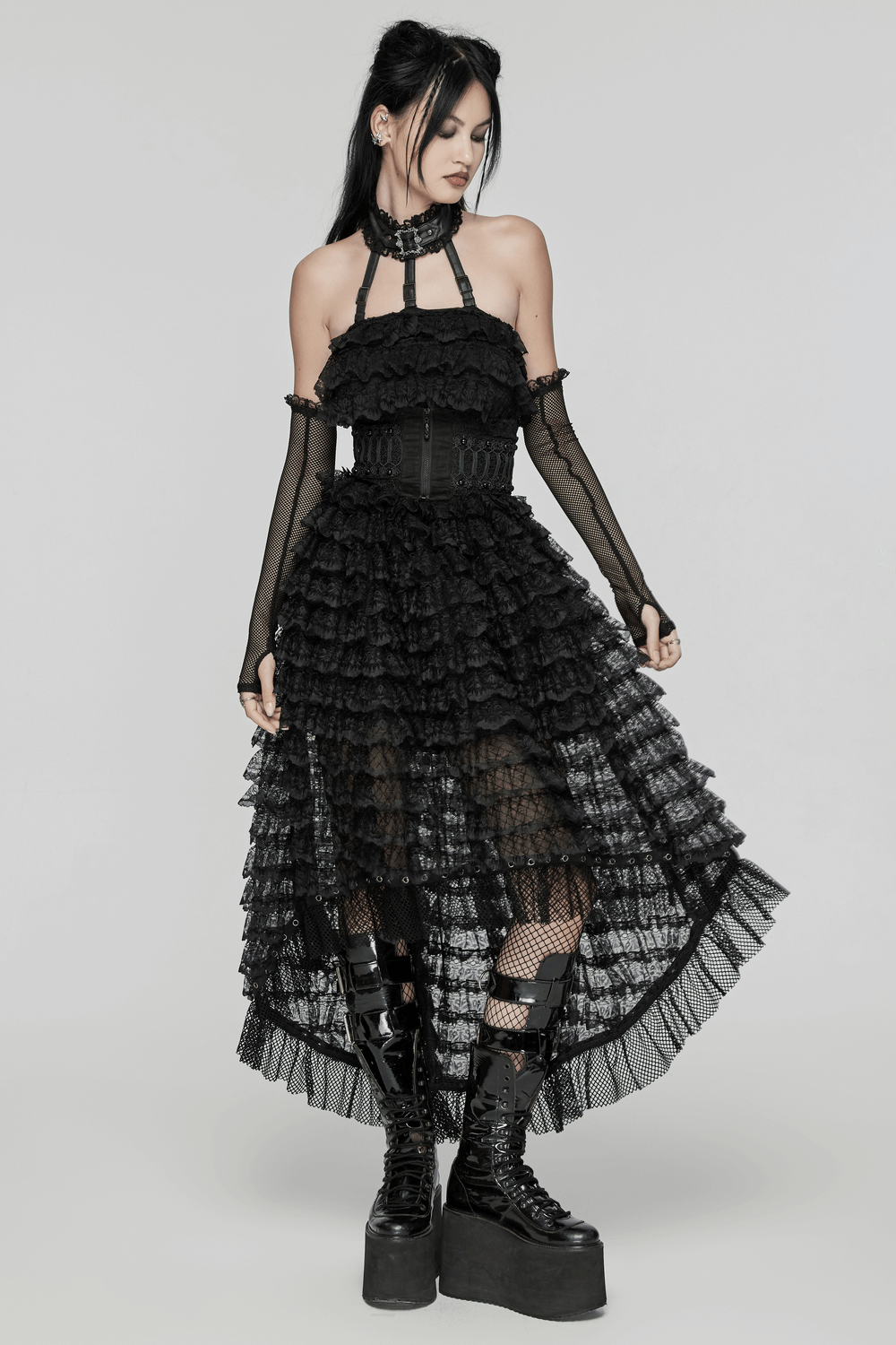 Unforgettable women's lace high-low hem black dress with gothic mesh layers and edgy accessories.