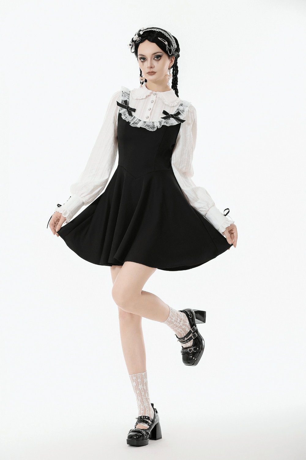 Unique Black and White Dress with Lace Collar and Bows worn by model, showcasing gothic style with ruffles and puff sleeves.