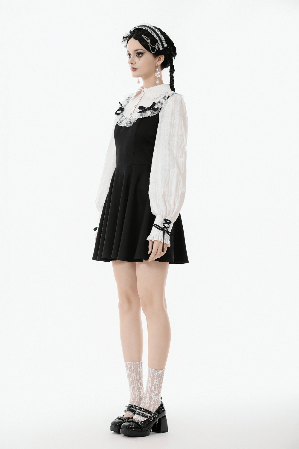 Unique Black and White Dress with Lace Collar and Bows on a mannequin, showcasing a Gothic Lolita style.