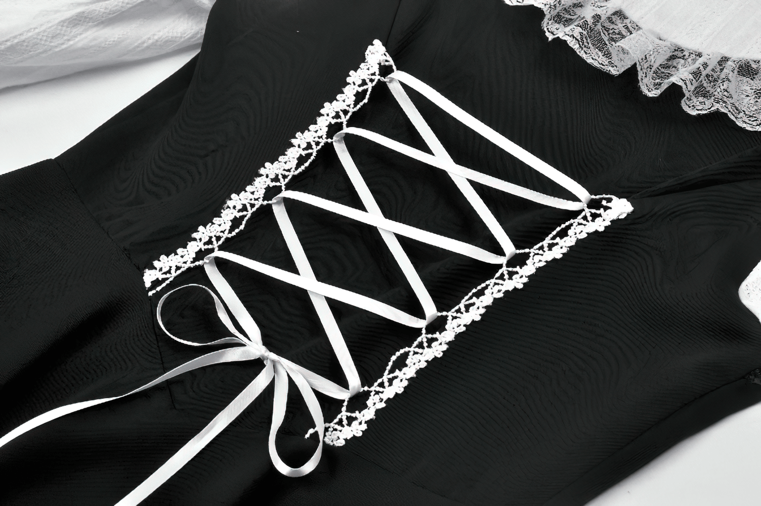 Unique Black and White Dress with Lace Collar and Bows showcasing intricate lace-up back design.