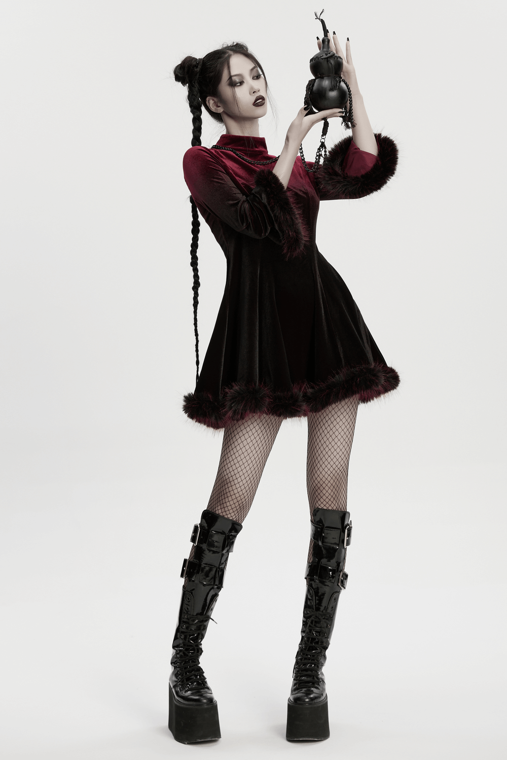 Unique Black Crossbody Mini Bag with Chains and Tassels held by a model in a gothic outfit.