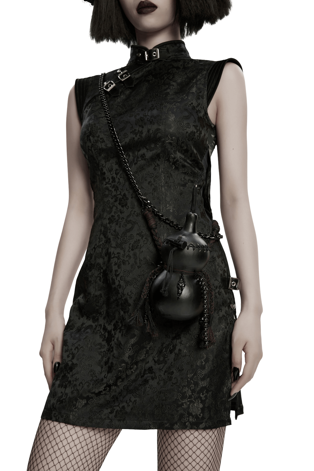 Unique Black Crossbody Mini Bag with Chains and Tassels worn with a gothic dress, featuring tassels and a bold style.