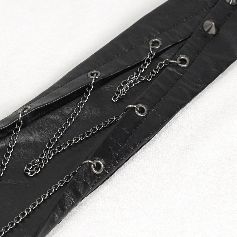 Close-up of a unique black necktie featuring chains and spike rivets, showcasing punk style.