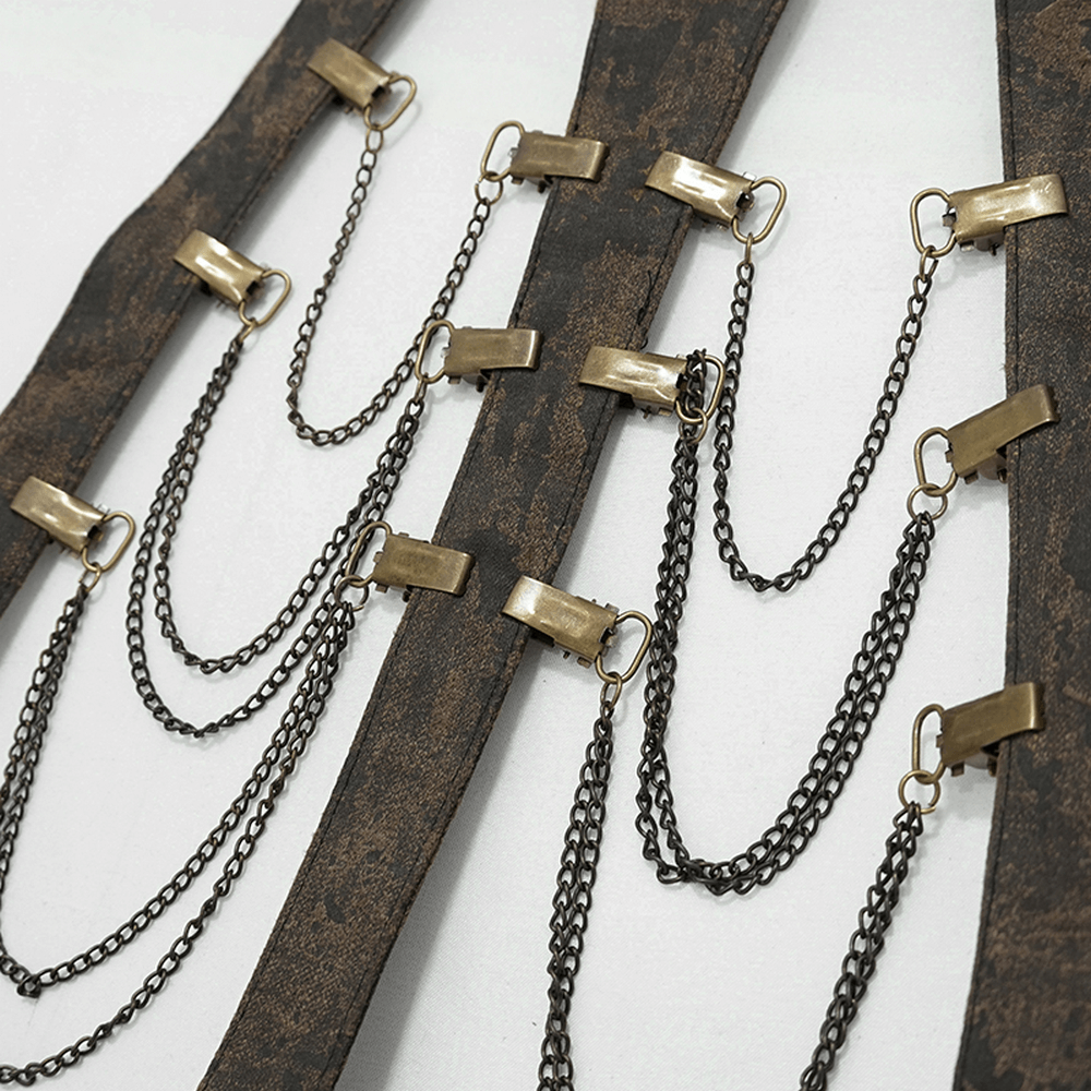 Close-up of vintage gothic body harness with brown leather straps and bronze metal chains for women.