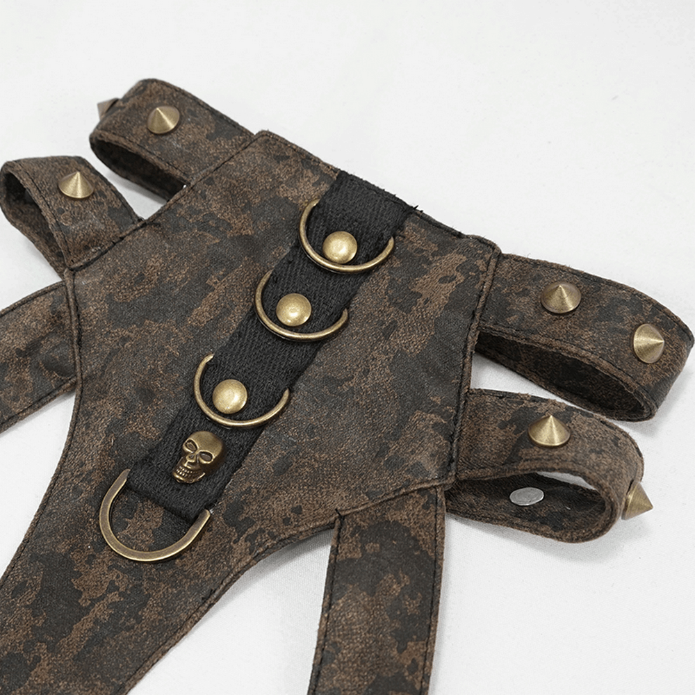 Unique vintage brown leather body harness with bronze fittings and skull detail, ideal for a gothic look.