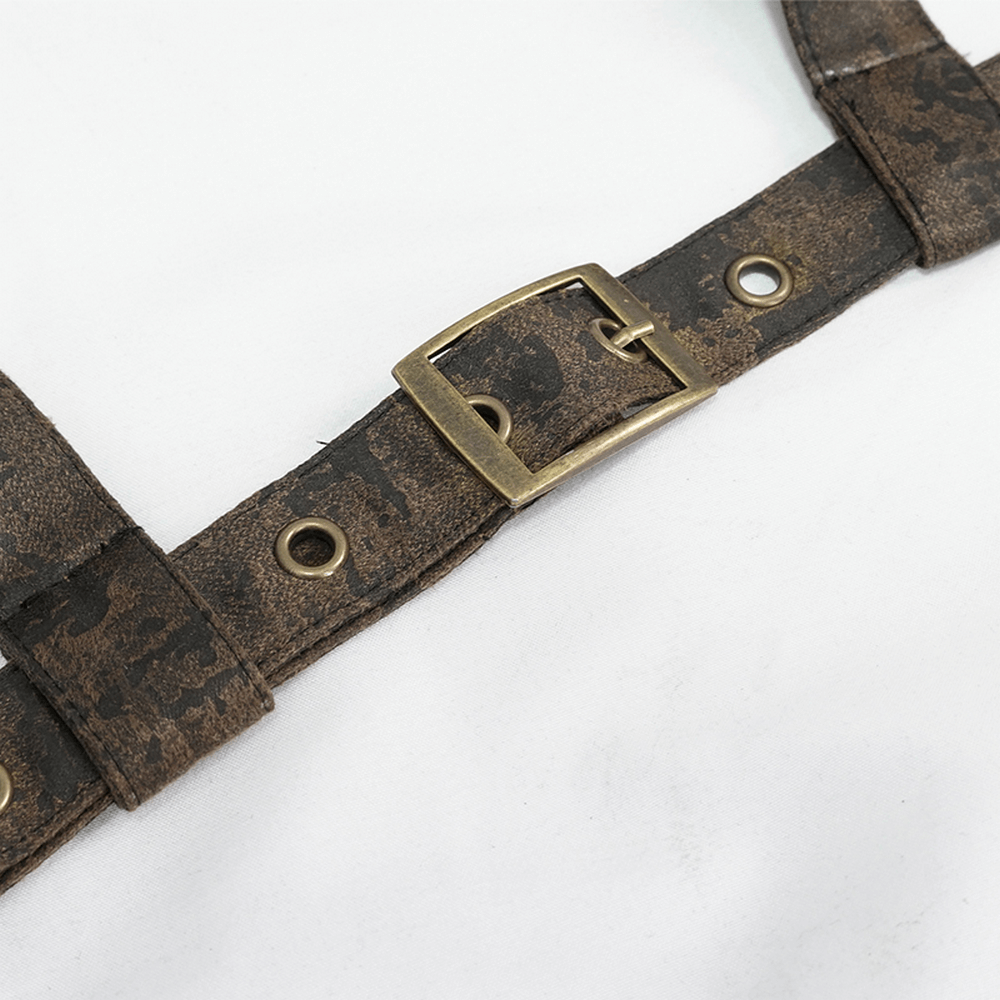 Close-up of vintage brown leather body harness with bronze buckle and fittings, perfect for a gothic style.