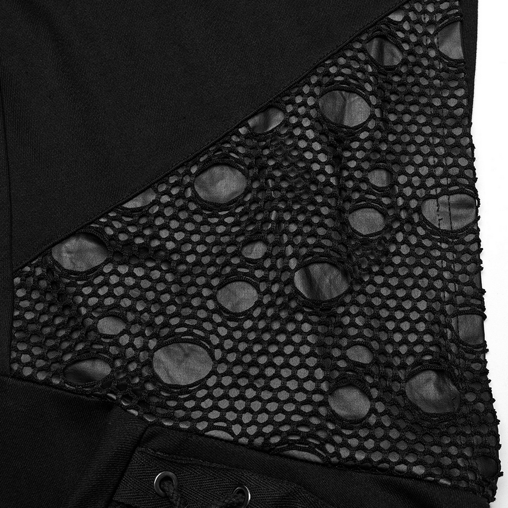 Close-up of black hoodie featuring unique mesh panel with circular cutouts for a gothic and edgy look.