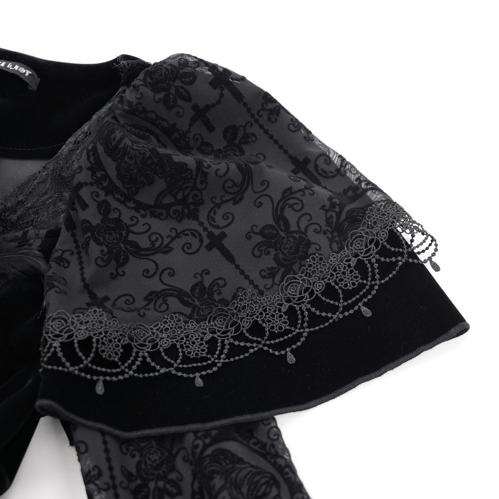 Close-up of intricately detailed ruffled sleeve of a unique Victorian lace dress in elegant black.