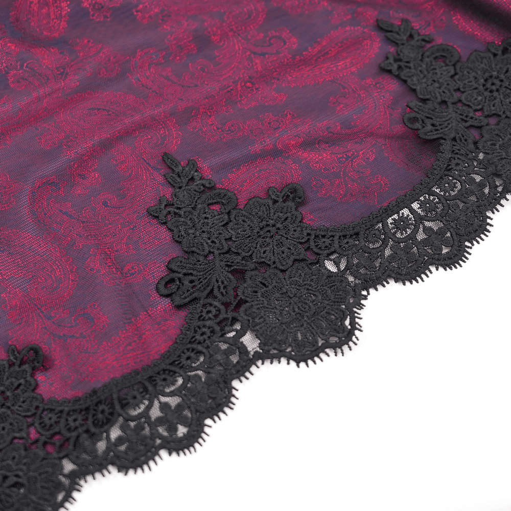 Intricate black lace trim on a rich burgundy fabric, showcasing elegant vintage pattern and detailed design.