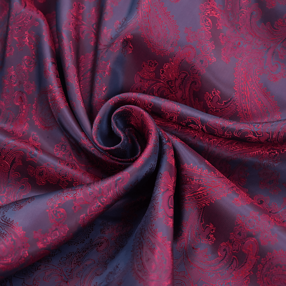 Luxurious dark blue and burgundy paisley fabric with intricate patterns, perfect for elegant garments and crafts.