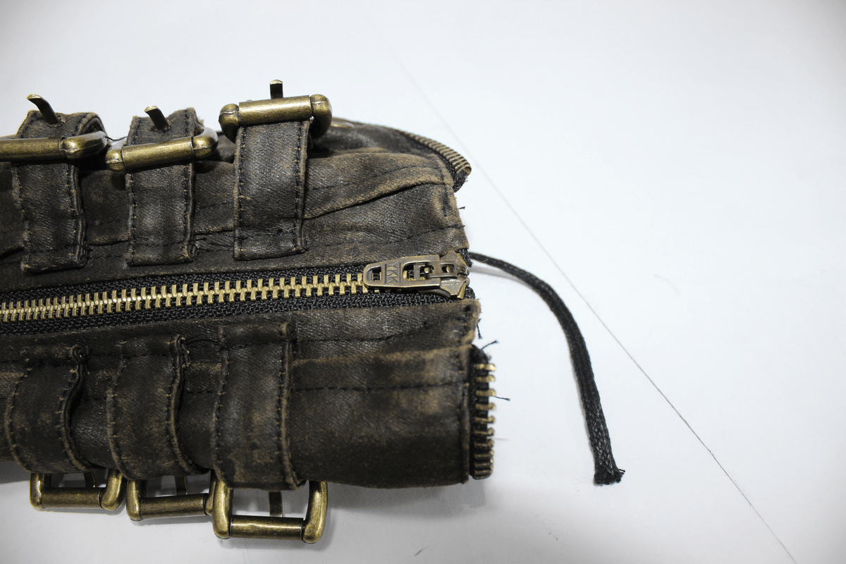 Vintage brown steampunk gauntlet gloves with buckles and zipper detail, perfect for costume enthusiasts.