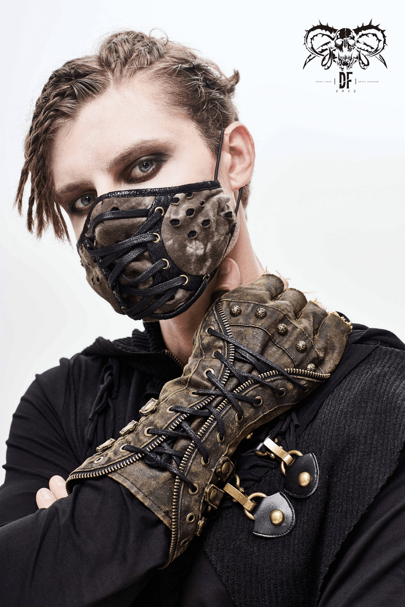 Model wearing steampunk fingerless gloves and a matching mask, showcasing edgy fashion with intricate details.