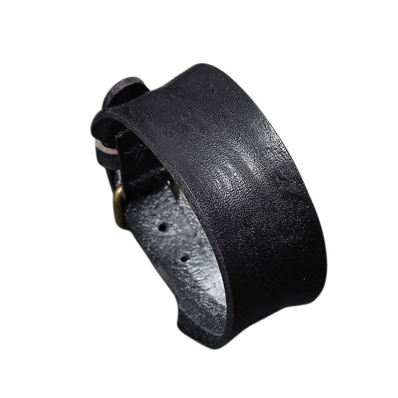 Unisex wide black leather bracelet in punk style, stylish and trendy accessory for fashion enthusiasts.