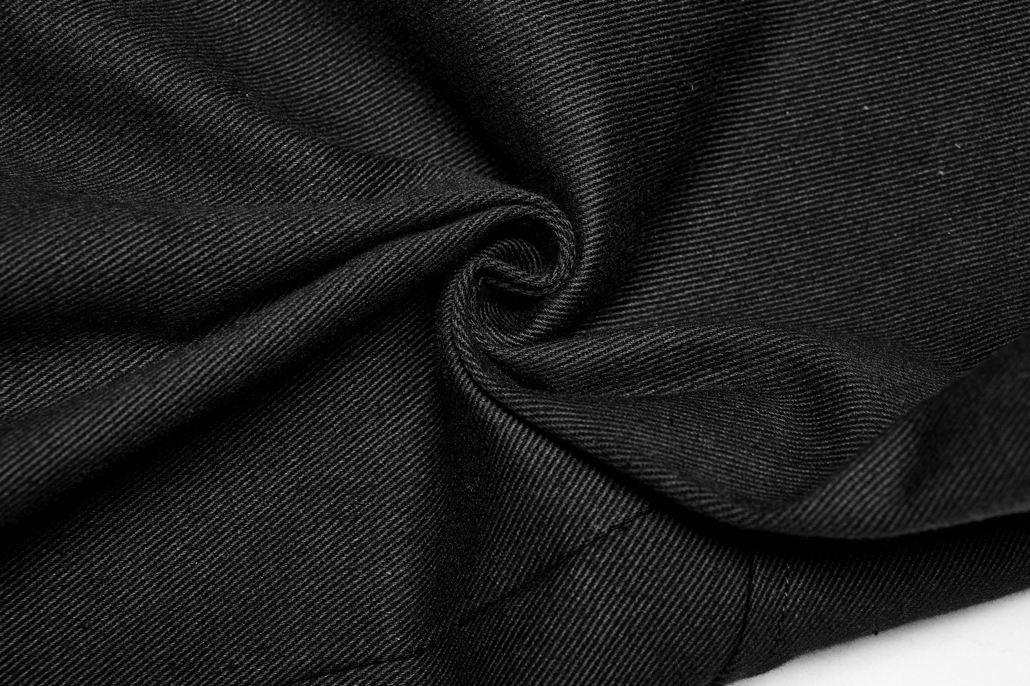 Close-up of soft, durable black twill fabric, perfect for stylish cargo pants with a sleek look.