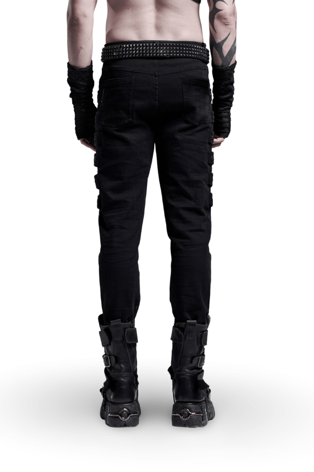 Back view of a model wearing Urban Black Cargo Trousers with distinctive strap details and stylish combat boots.