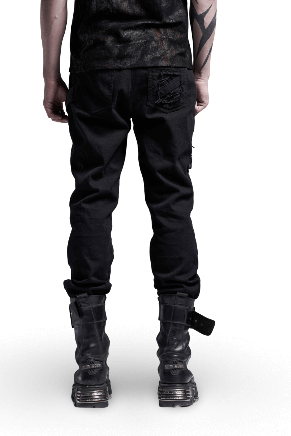 Back view of Urban Gothic cargo pants with buckled straps and edgy design, paired with black boots.