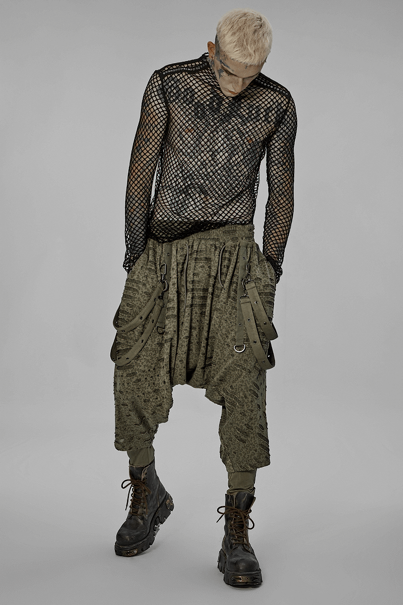 Urban Gothic Harem Pants with detachable straps, styled with a mesh top and rugged boots for an edgy look.