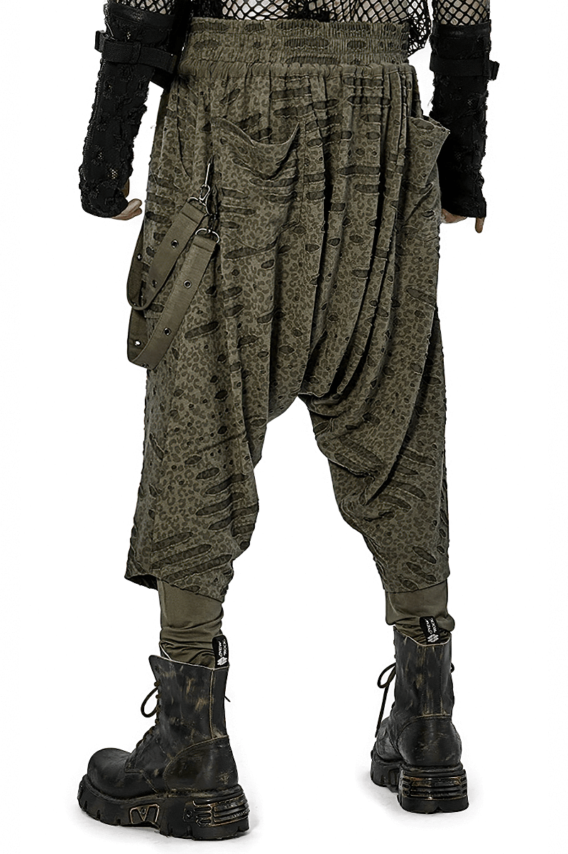 Urban Gothic harem pants with detachable straps, showcasing an edgy silhouette and comfortable fit, paired with combat boots.