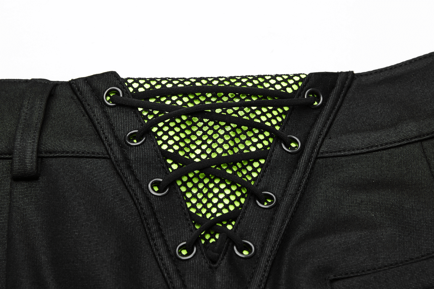 Close-up of Urban Punk leggings showing fluorescent green mesh detailing and lace-up closure for a trendy look.