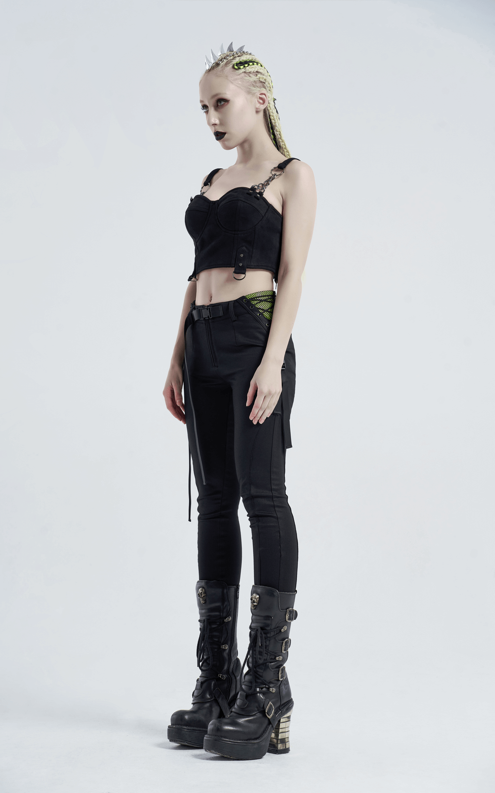 Model showcasing Urban Punk Leggings with zip and bandage detail, paired with a stylish black crop top and edgy boots.