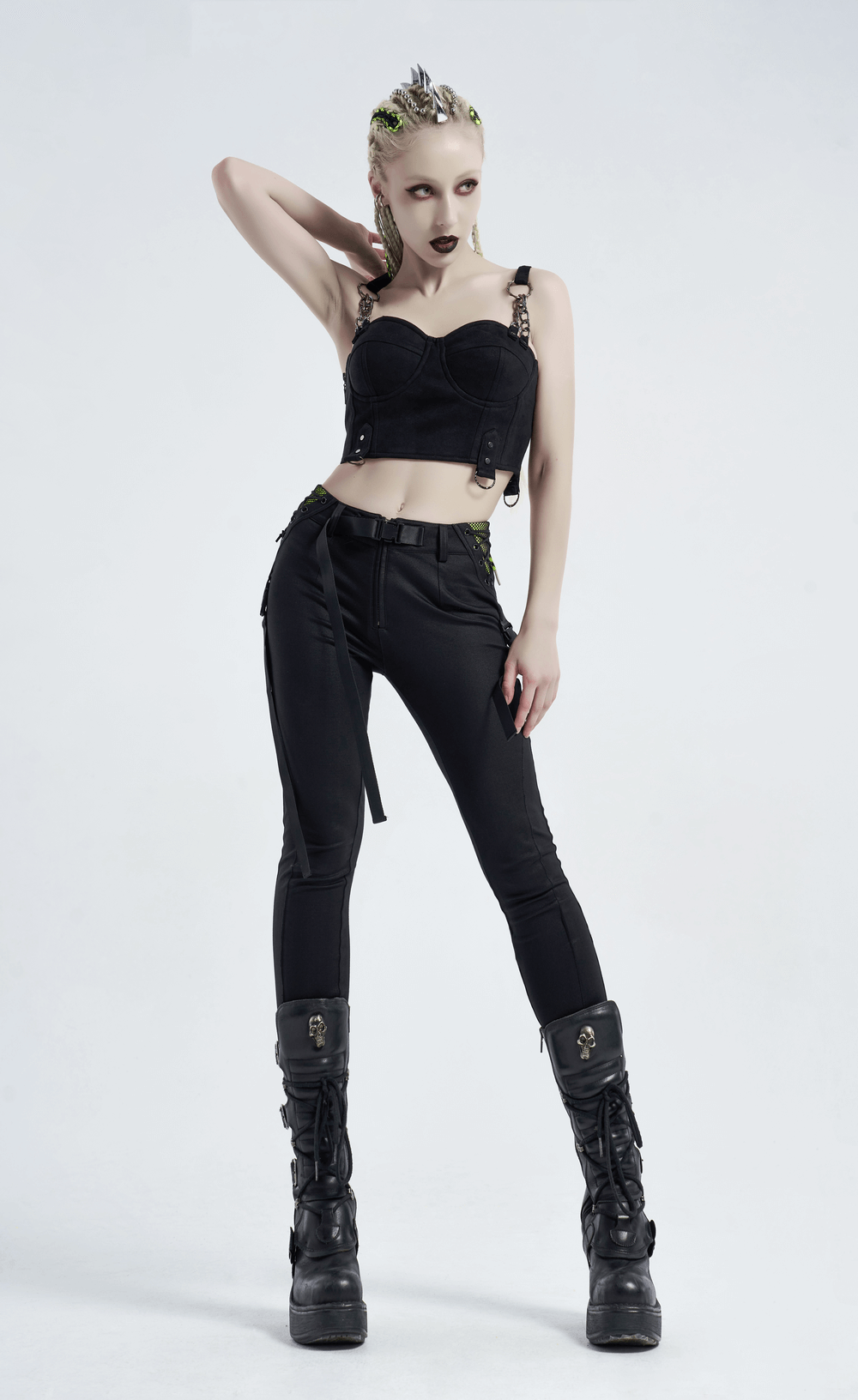Urban Punk model showcasing zippered leggings and edgy crop top with bold styling and combat boots.