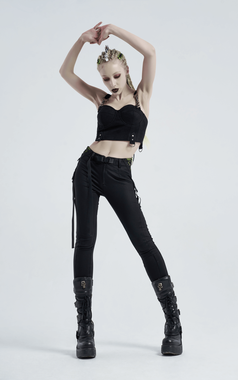 Urban Punk black leggings with zip and bandage details, styled with a fierce cropped top and edgy boots.
